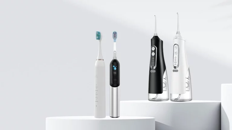 Oral care product line with two electric toothbrushes and two cordless water flossers on white studio pedestals